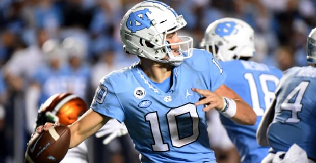 North Carolina Tar Heels quarterback Drake Maye drops back for a pass in a college football game in the ACC.